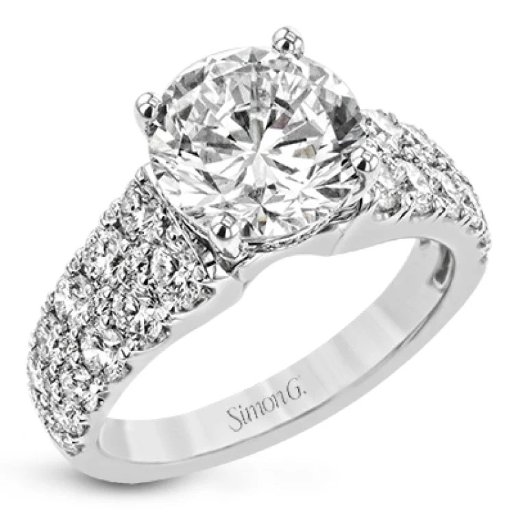 Women’s pear diamond engagement rings-This bold engagement ring contains 1.50 ctw of side diamonds and will be sure to draw anyone's eyes with its modern design.