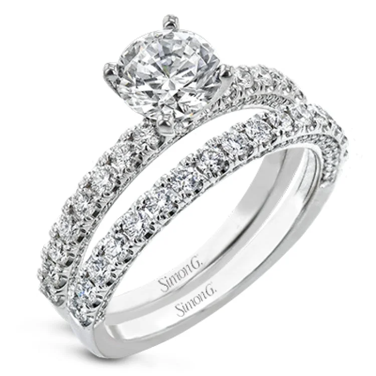 Women’s cushion diamond engagement rings-This engagement ring is sure to shine, with a classic straight design set with .49 ctw of white side diamonds.