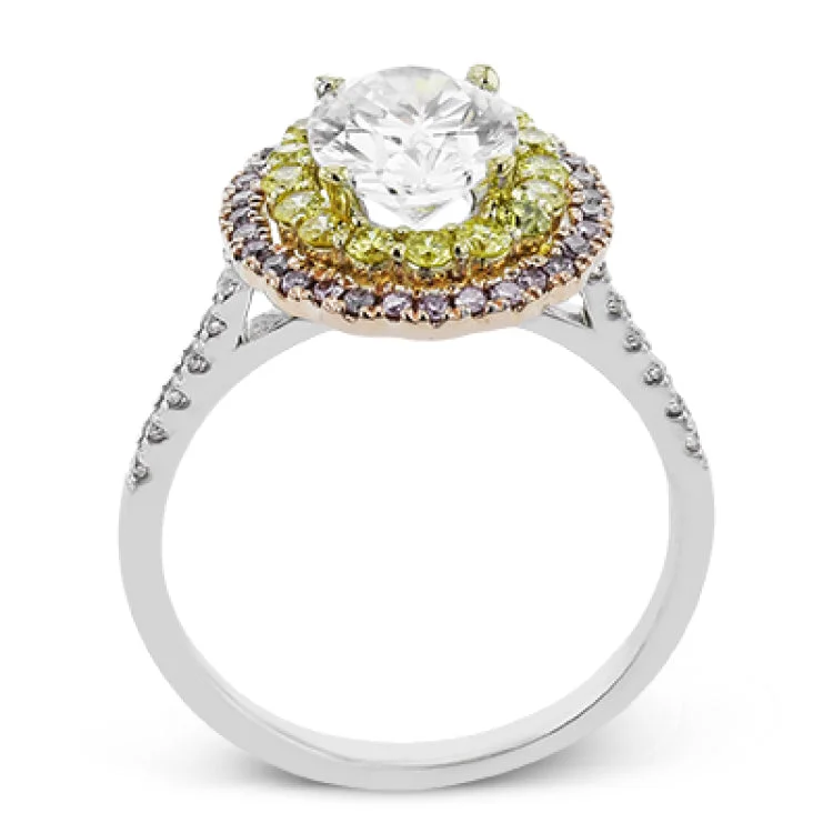 Women’s emerald engagement rings-This tri-color oval engagement ring really makes a statement with a double halo of natural color diamonds. The inner halo has 0.40 ctw of yellow diamonds and the outter halo has 0.20 ctw of pink diamonds, highlighted by 0.11 ct of white diamonds