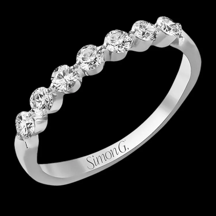 Women’s platinum diamond engagement rings-The perfect compliment to a solitare, this 7-stone diamond wedding band in 14K white gold adds just the right amount of sparkle