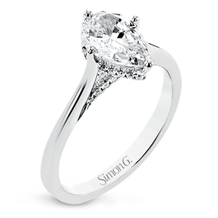 Women’s vintage engagement rings-This elegant white gold engagement ring takes an oval center and is adorned with a delicate under halo, and a line of diamonds on the side profile 0.13 ctw