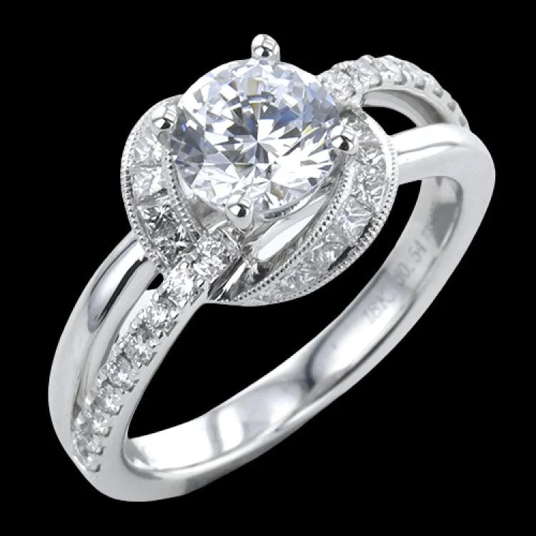 Women’s handcrafted engagement rings-This 18K white gold engagement ring has a split shank design with RD diamonds 0.21 ctw. on one side and high polish on the other side, and a diamond halo with fine millgrain trim, of princess cut stones 0.33 ctw.