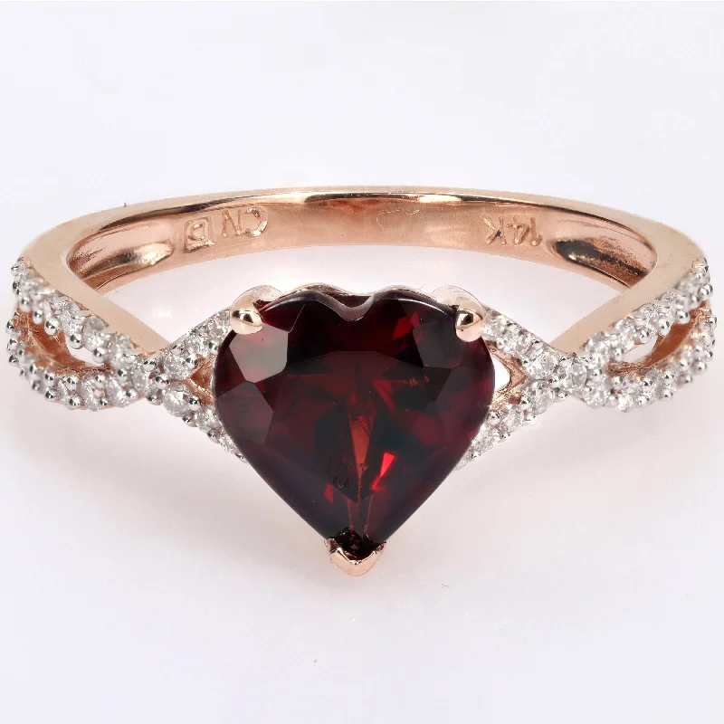 Women’s diamond ring-Miadora Heart-cut Garnet and 1/5ct TDW Diamond Crossover Ring in 14k Rose Gold