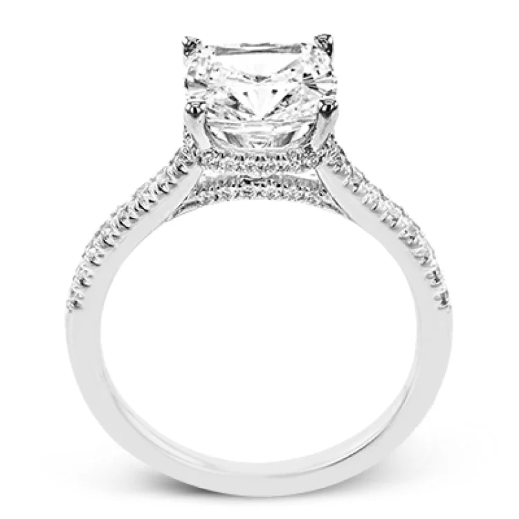 Women’s solitaire engagement rings-This 18K engagement ring from our under halo collection evokes understated elegance, with 0.30 ctw of delicate diamonds on the shank, the lower halo, and the bridge.