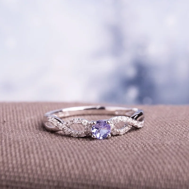 Women’s gemstone ring-Miadora Sterling Silver Tanzanite and 1/10ct TDW Diamond Ring (H-I, I2-I3)