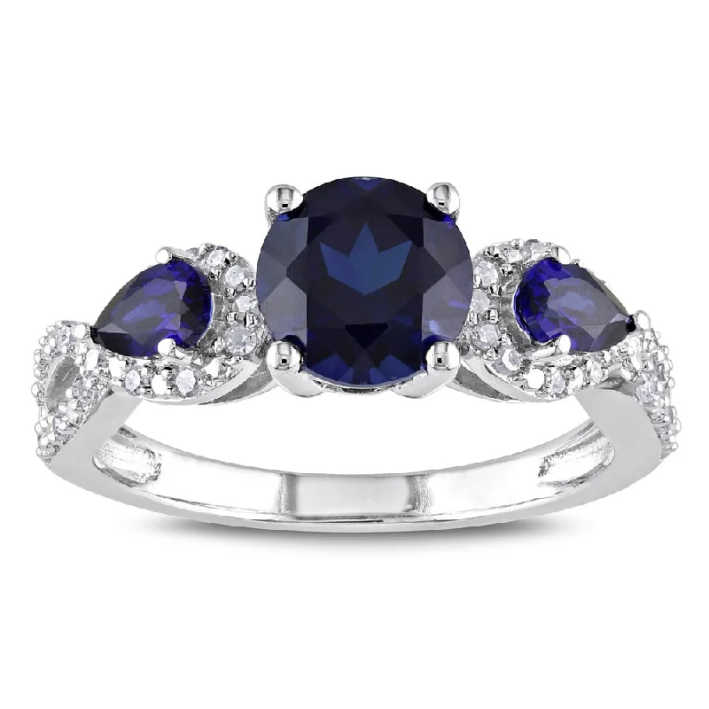 Women’s diamond eternity ring-Miadora Sterling Silver Created Sapphire and 1/6ct TDW Diamond 3-Stone Crossover Ring